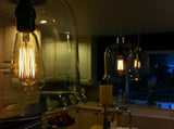 Edison Bulb - 60 Watt - 5.5 In. Length - Squirrel Cage Filament - Amber - Nostalgicbulbs.com